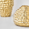 A close-up of a golden wrinkle ceramic tabletop vase with textured, undulating lines.