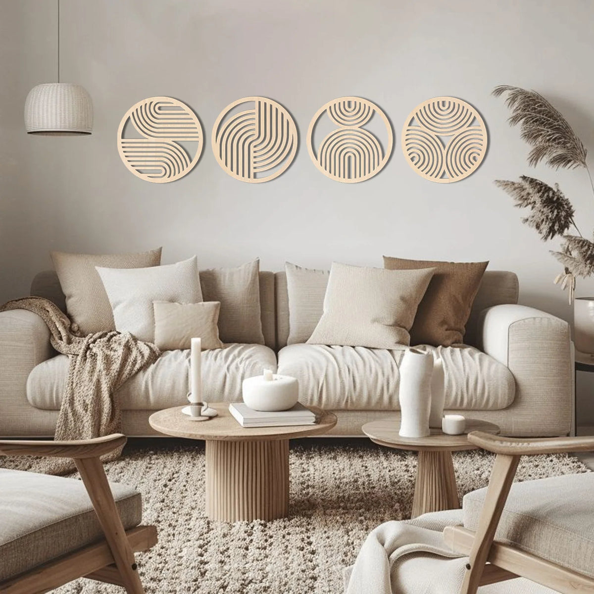A set of four round wooden wall art pieces with concentric line patterns displayed on a light gray wall above a beige sofa.