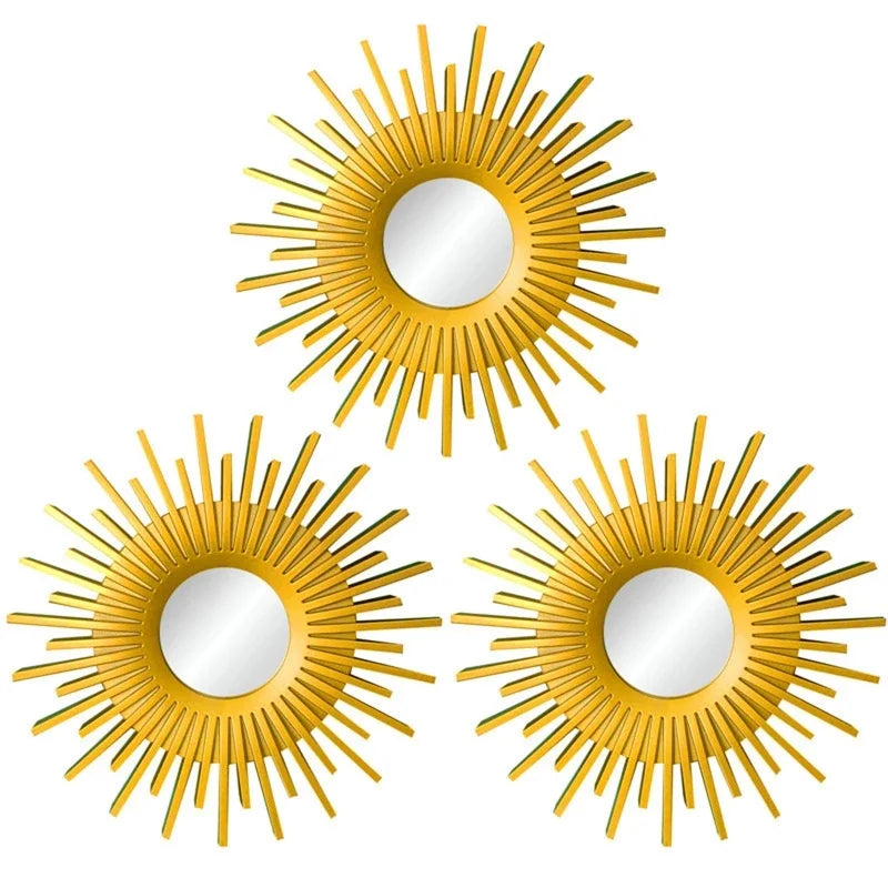 A set of three gold sunflower wall mirrors with circular reflective surfaces.