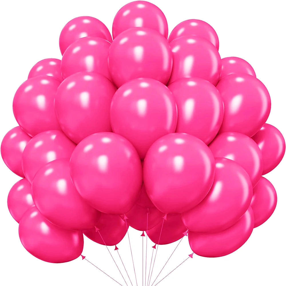 A cluster of pink latex balloons for parties, showing various shades of pink and magenta.