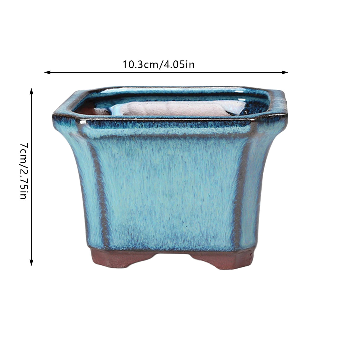 A rectangular ceramic succulent planter in blue and brown tones with a drainage hole.