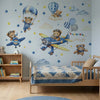 Wall stickers featuring teddy bear pilots flying airplanes against a light blue sky background