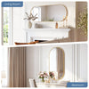 An oval wall mirror with a gold metal frame is displayed above a white fireplace mantel in a bright living room.