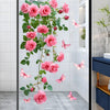 Pink rose and butterfly floral window decal featuring pink roses and delicate butterflies on a glass panel.
