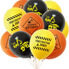 A bunch of orange and yellow latex balloons featuring construction tractor and excavator designs for a birthday celebration.