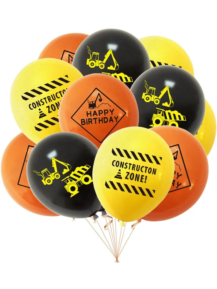 A bunch of orange and yellow latex balloons featuring construction tractor and excavator designs for a birthday celebration.