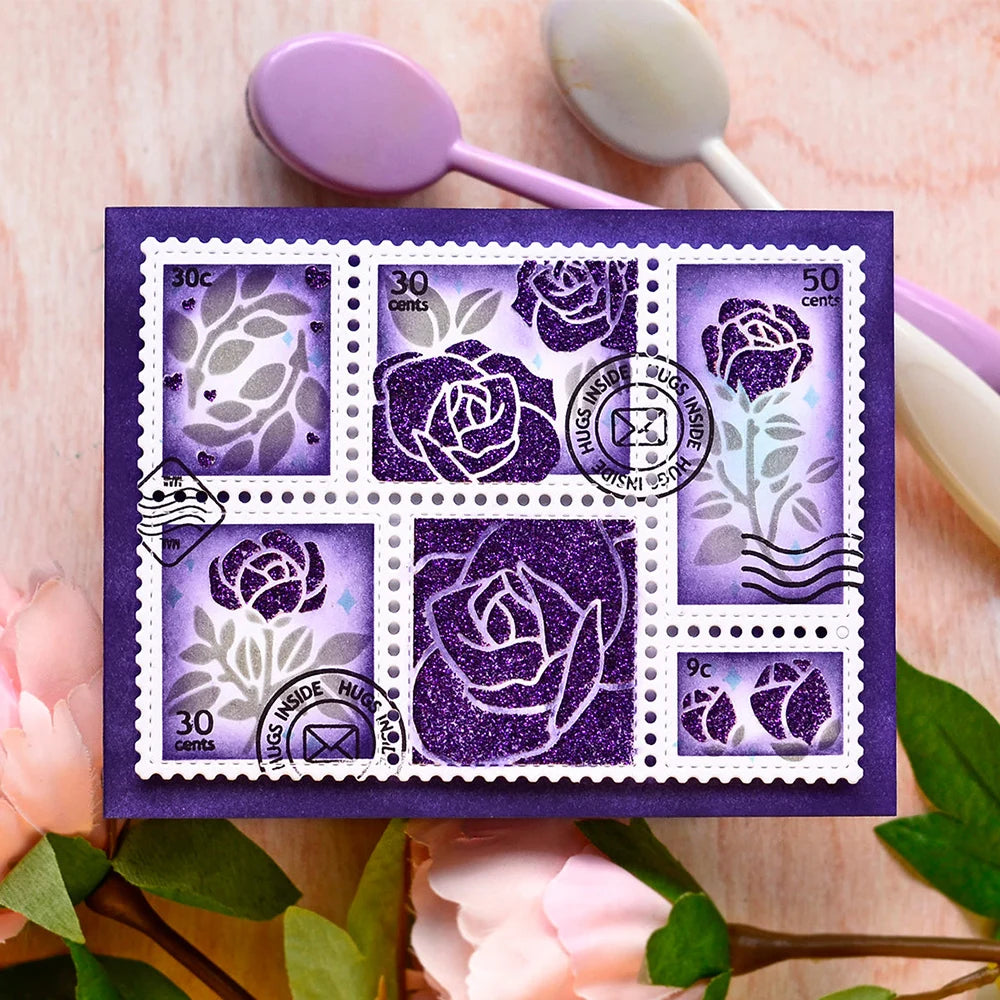 A purple postage stamp set featuring floral designs and words on a square card with pink flowers in the background.