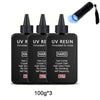 Three bottles of UV resin formulated for artists with a light source