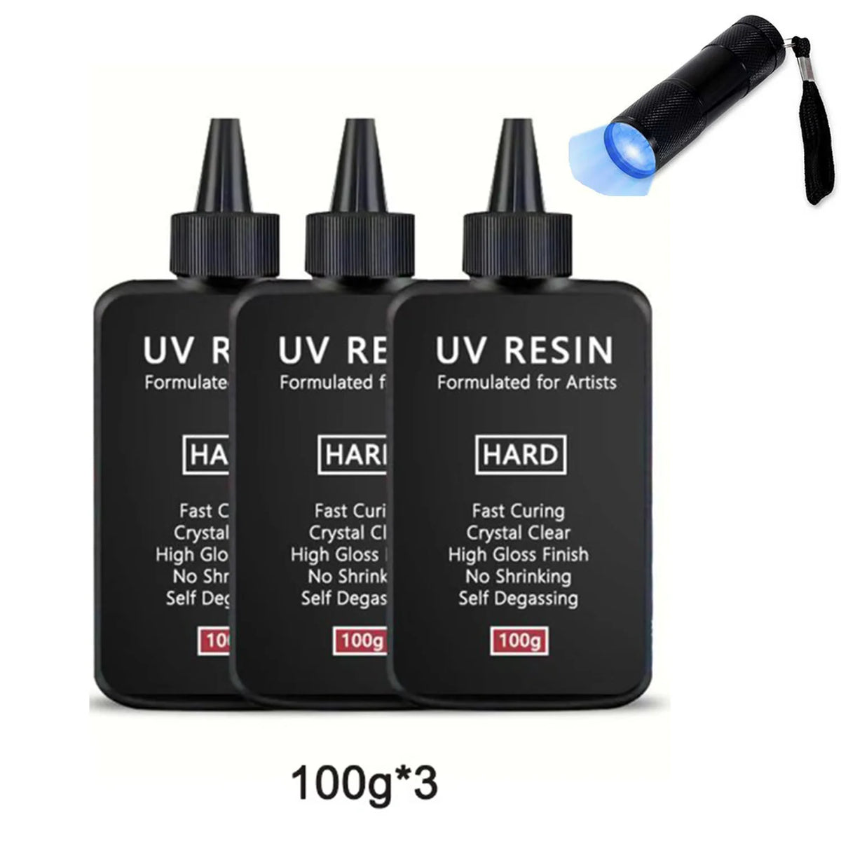 Three bottles of UV resin formulated for artists with a light source