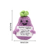 Handmade crochet positive eggplant doll with a small pocket containing an inspirational message
