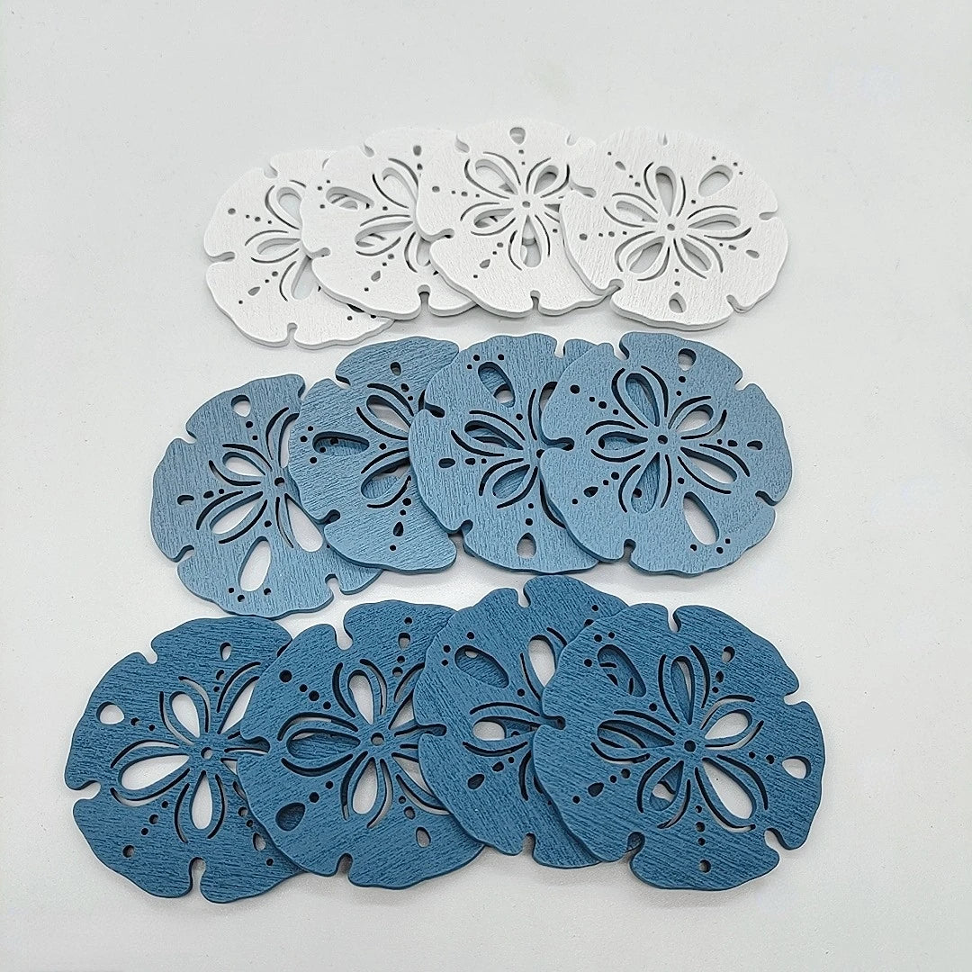 A collection of twelve wooden ocean ornaments featuring various sea life shapes like shells, scallops, and starfish.