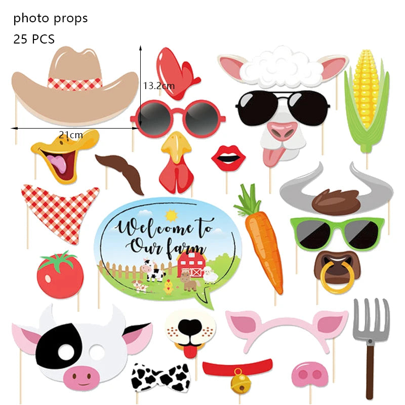 A collection of photo props for a farm ranch birthday party including a cowboy hat, sunglasses, corn, tomato, and various ani