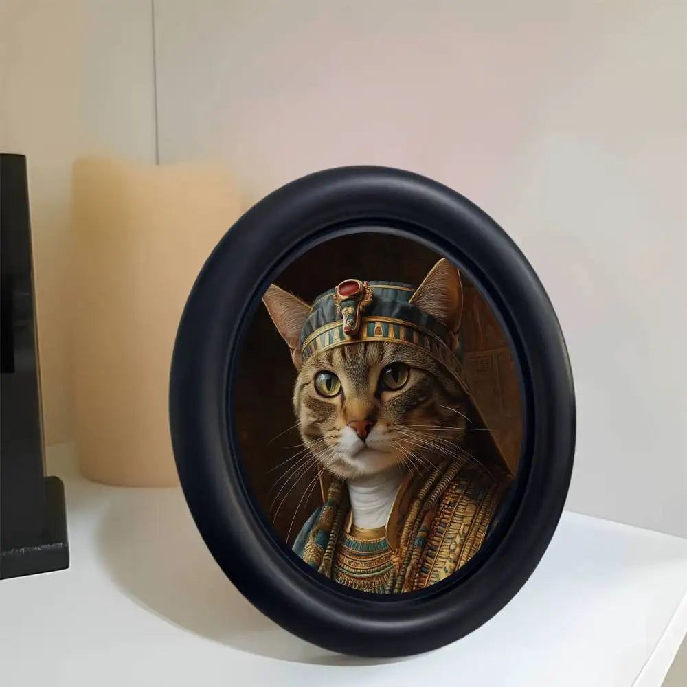 A round black photo frame featuring a Renaissance portrait of a tabby cat wearing a crown and gold jewelry.