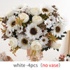Un bouquet de fleurs artificielles blanches, comprenant des pivoines et des marguerites, arrangé pour la décoration.