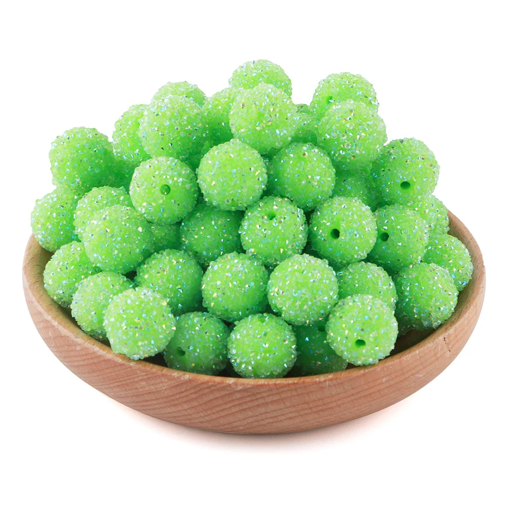 A pile of bright lime green textured resin beads for jewelry making