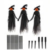 A set of light-up witches decorations featuring three black ghost figures with orange faces and black rods.