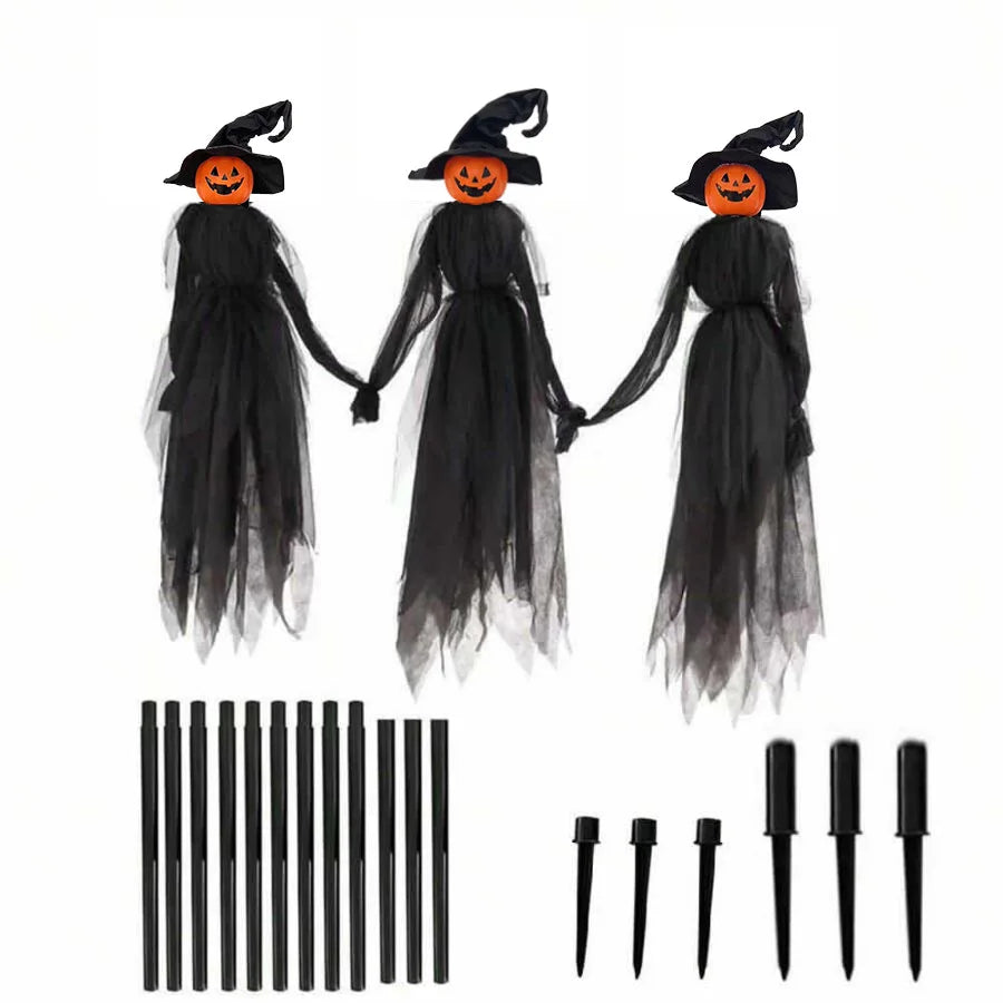 A set of light-up witches decorations featuring three black ghost figures with orange faces and black rods.