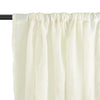 Cream natural linen sheer curtains with a gathered rod pocket hanging from a black rod.