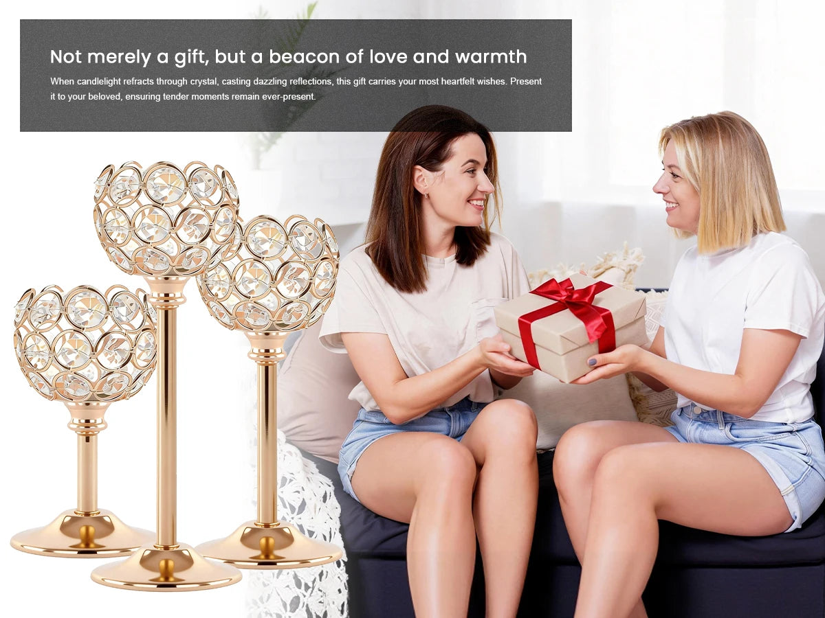 Two women are presenting a gift box wrapped in red ribbon to each other, with elegant metal glass candle holders visible.