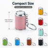 A variety of mini coin holder keychains in pink, red, teal, green, blue, brown, and black colors displayed against a white ba