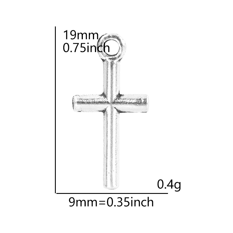A silver cross charm measuring 19mm long and 0.75 inches, weighing 0.4 grams.