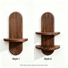 Two styles of wall-mounted wooden storage racks featuring vertical ribbed designs in a dark brown wood finish.