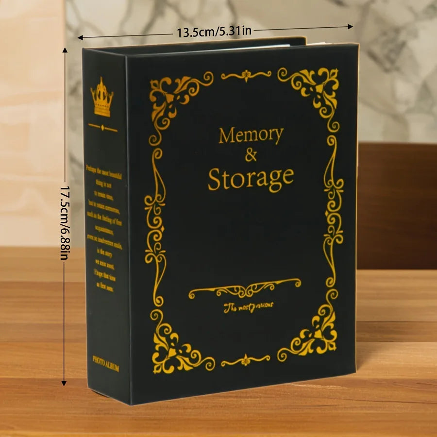 A black photo album with gold foil detailing, titled Memory & Storage.