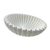 A white modern ruffle scalloped decorative bowl with deeply ribbed exterior.