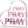 A heart-shaped acrylic sign with pink text that reads Pray on it Pray over it Pray through it