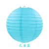 A light blue, round paper lantern with a twisted texture.