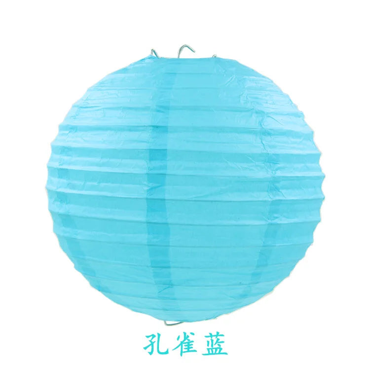 A light blue, round paper lantern with a twisted texture.