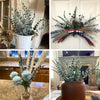 A collection of artificial eucalyptus leaf plants in various sizes and arrangements for home decor.
