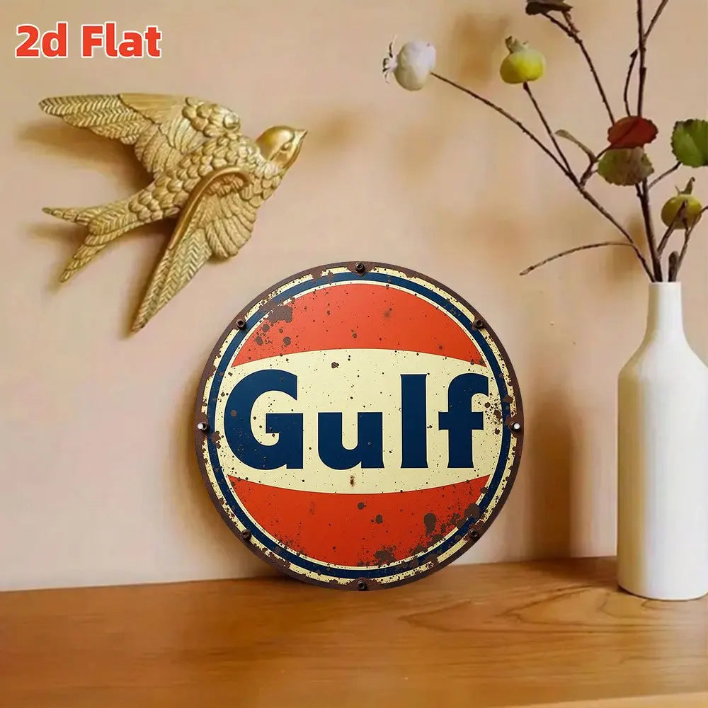 Vintage round metal wall sign featuring a golden eagle and the word Gulf on an orange background