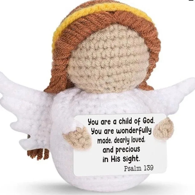 Handmade crochet angel doll with brown hair and white wings, featuring an inspirational card.