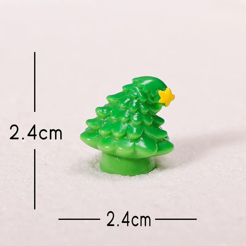 A small, bright green resin Christmas tree charm with a yellow star on top, shown against a white background.