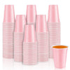 A stack of pink mini plastic shot cups for parties and events