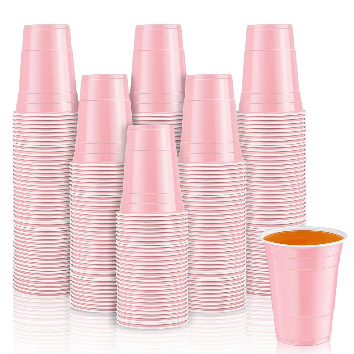 A stack of pink mini plastic shot cups for parties and events