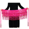 A woman models a bright pink sequin hula dancer skirt with tassel belts.