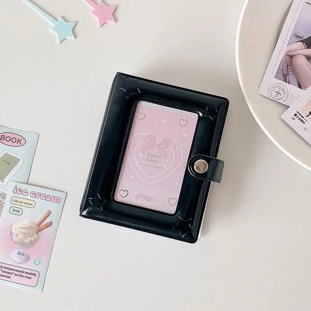 A black photo card holder album with a pink cover featuring a sweet love design and a small leather closure.