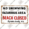 A distressed wooden sign with black text warning No Swimming Hazardous Area Beach Closed by Order Amity P.D.