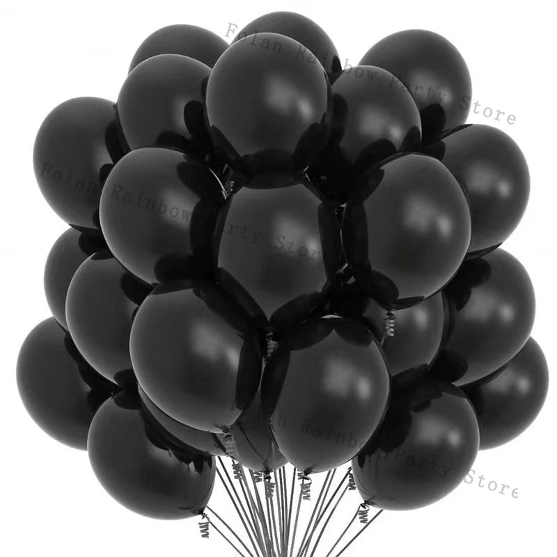 A bunch of black matte latex balloons tied together, ready for a party decoration.