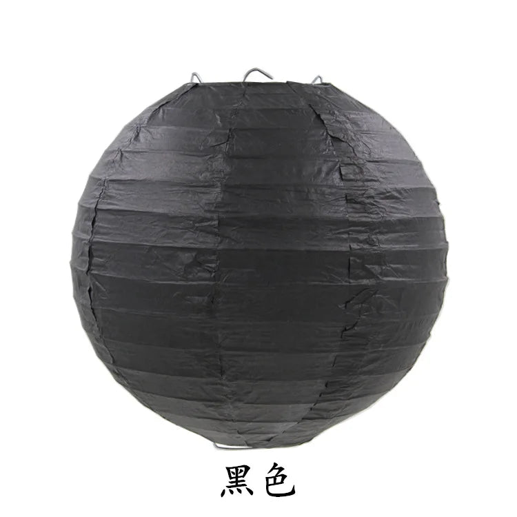 A round black paper lantern used for parties and weddings.