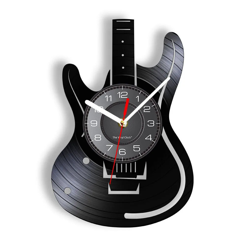 A black electric guitar shaped wall clock with a vinyl record face and hands.