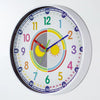 A colorful silent wall clock with a white face and blue hands showing the time.