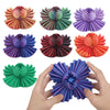 A collection of colorful 3D printed gear ball fidget spinners in various shades of pink, purple, green, and orange.