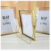 Three modern gold-framed floating picture frames display the text Keep life simple on white acrylic panels.