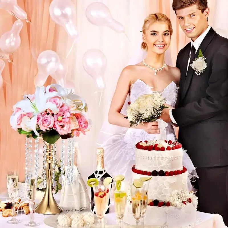 A wedding photo featuring a bride and groom, with a crystal flower centerpiece stand and candle holder on the table.
