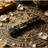 A black wishing willow stick with a breakable wish box resting on an old map or parchment.