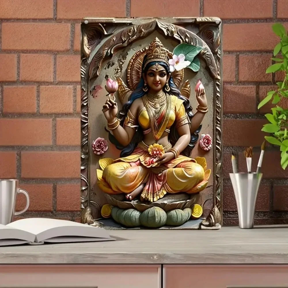 A metal wall art statue of Goddess Durga Lakshmi seated in a lotus, adorned with flowers and jewelry.