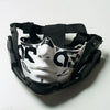 A black half face mask with a white stylized face design and black straps.